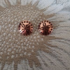 Scalloped shaped solid copper earrings with a floral design